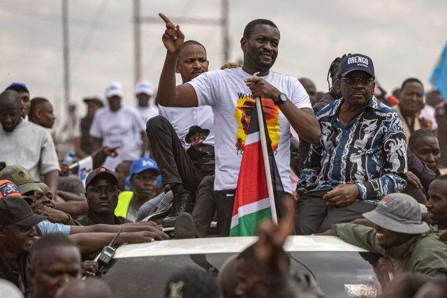 Nairobi Senator Edwin Sifuna waves at his supporters  ahead of the Linda Mwananchi (protect citizens) political rally in Nairobi on September 13, 2026. A heavy police presence was deployed in Nairobi for a rally by a rising opposition star on Sunday, following a wave of political violence in recent weeks.
Edwin Sifuna has emerged as the biggest threat to President William Ruto ahead of the latter's bid for re-election in August 2027.
Sifuna, 44, has built momentum by tapping into widespread anger over corruption and political violence, though others argue he is too young and inexperienced for the top office.
His rally began with a church visit in central Nairobi early Sunday, with hundreds of rowdy supporters already gathered outside and a large number of police officers maintaining a perimeter, AFP journalists saw. (Photo by SIMON MAINA / AFP)
