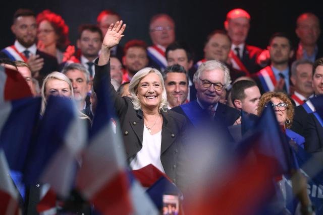 President of the far-right Rassemblement National (RN) parliamentary group and 2027 French presidential candidate Marine Le Pen (C) waves as she arrives to deliver a speech at a rally for the start of the new political year in Henin-Beaumont, northern France, on September 13, 2026. (Photo by Thomas SAMSON / AFP)