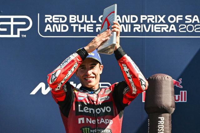 Ducati Lenovo Team's Spanish rider Marc Marquez holds his trophy on the podium following his victory at the end of the San Marino Moto GP Grand Prix at the Misano World Circuit Marco Simoncelli, in Misano Adriatico, northern Italy on September 13, 2026. (Photo by Andreas SOLARO / AFP)