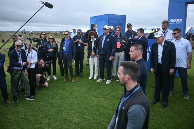US President Donald Trump (front R) attends the final round of the Irish Open golf tournament at the Trump International Golf Links & Hotel, a resort and golf course owned by the president, in Doonbeg, western Ireland on September 13, 2026. Trump turned his focus on September 13 to golf and promoting his business interests, as he wraps up a two-day visit to Ireland during which his off-the-cuff diplomacy has caused another stir. (Photo by Brendan SMIALOWSKI / AFP)
