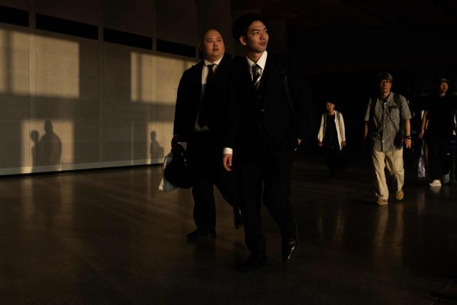 Passengers look outside of Terminal 1 as they walk to their gates at Haneda International Airport in Ota on September 13, 2026. (Photo by ANDREW CABALLERO-REYNOLDS / AFP)