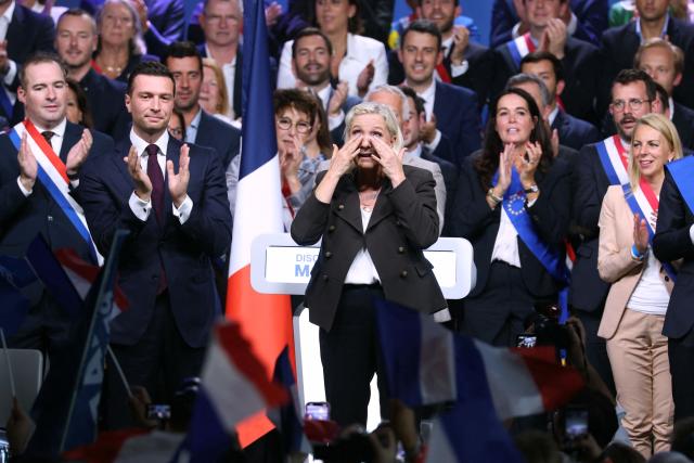 President of the far-right Rassemblement National (RN) parliamentary group and 2027 French presidential candidate Marine Le Pen (C) reacts flanked by RN President Jordan Bardella (2nd L) at the end of a rally for the start of the new political year in Henin-Beaumont, northern France, on September 13, 2026. (Photo by Thomas SAMSON / AFP)