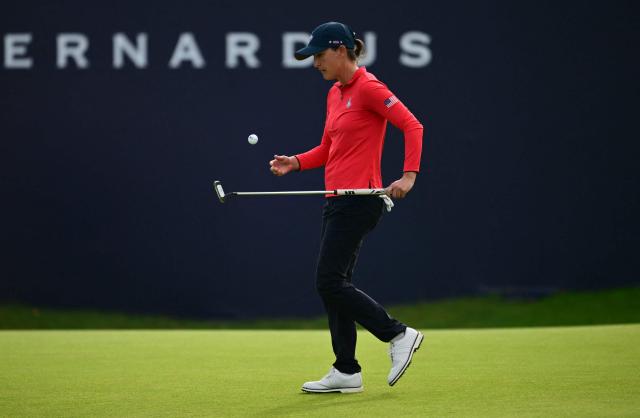 US teams golfer Lindy Duncan juggles a ball after making a putt during play in her singles match against Team Europe’s Swedish golfer Maja Stark on the final day of the 2026 Solheim Cup biennial team golf competition on The Bernardus Golf Course at Cromvoirt, some 80kms south-east of Rotterdam on September 13, 2026. (Photo by NICOLAS TUCAT / AFP)