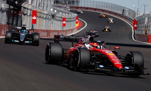 Ferrari's Monegasque driver Charles Leclerc (R) competes in the Spanish Formula One Grand Prix at the Madring circuit on September 13, 2026 in Madrid. (Photo by Oscar DEL POZO / AFP)