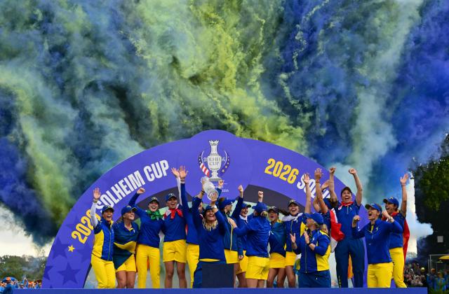 Team Europe’s Swedish captain Anna Nordqvist (C) lifts the trophy after victory on the final day of the 2026 Solheim Cup biennial team golf competition on The Bernardus Golf Course at Cromvoirt, some 80kms south-east of Rotterdam on September 13, 2026. (Photo by NICOLAS TUCAT / AFP)