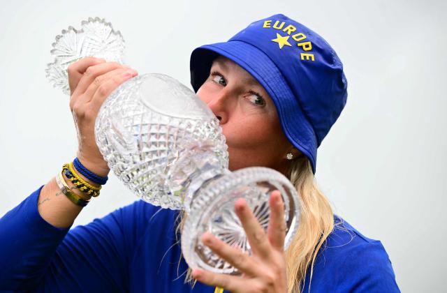 TOPSHOT - Team Europe’s Swedish captain Anna Nordqvist kisses the trophy after victory on the final day of the 2026 Solheim Cup biennial team golf competition on The Bernardus Golf Course at Cromvoirt, some 80kms south-east of Rotterdam on September 13, 2026. (Photo by NICOLAS TUCAT / AFP)