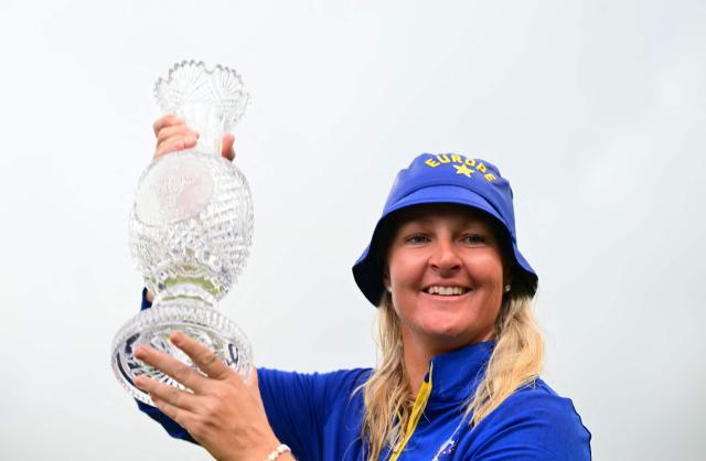 Team Europe’s Swedish captain Anna Nordqvist poses with the trophy after victory on the final day of the 2026 Solheim Cup biennial team golf competition on The Bernardus Golf Course at Cromvoirt, some 80kms south-east of Rotterdam on September 13, 2026. (Photo by NICOLAS TUCAT / AFP)