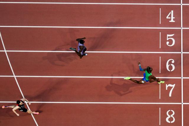 Brazil's Alison dos Santos (C) competes to win ahead of US' Rai Benjamin (top) and Norway's Karsten Warholm in the men's 400m hurdles final during the World Athletics Ultimate Championship at the Gyula Zsivotzky National Athletics Centre, in Budapest on September 13, 2026. (Photo by Jewel SAMAD / AFP)