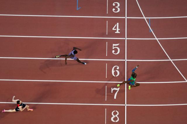 Brazil's Alison dos Santos (C) competes to win ahead of US' Rai Benjamin (top) and Norway's Karsten Warholm in men's 400m hurdles final during the World Athletics Ultimate Championship at the Gyula Zsivotzky National Athletics Centre, in Budapest on September 13, 2026. (Photo by Jewel SAMAD / AFP)