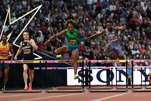 Brazil's Alison dos Santos (C) competes to win ahead of Norway's Karsten Warholm and US' Rai Benjamin (R) during the men's 400m hurdles final during the World Athletics Ultimate Championship at the Gyula Zsivotzky National Athletics Centre, in Budapest on September 13, 2026. (Photo by Jewel SAMAD / AFP)