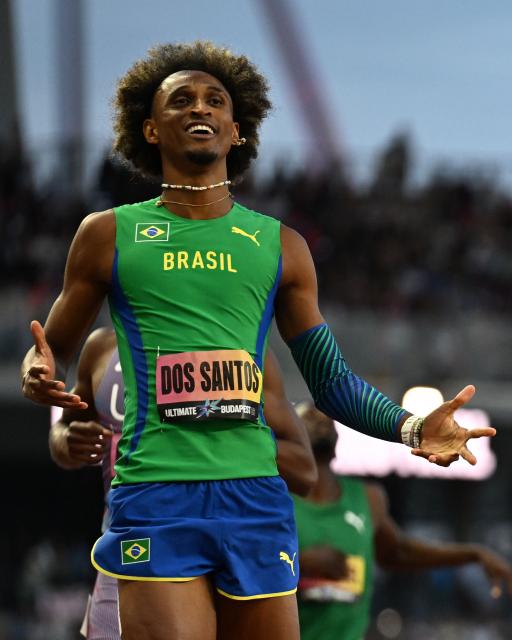 Brazil's Alison dos Santos celebrates after winning the men's 400m hurdles final during the World Athletics Ultimate Championship at the Gyula Zsivotzky National Athletics Centre, in Budapest on September 13, 2026. (Photo by Jewel SAMAD / AFP)