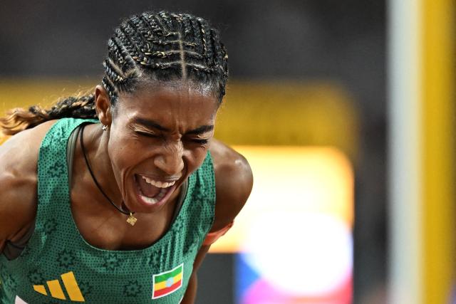 Ethiopia's Likina Amebaw celebrates her victory in the women's 5000m final during the World Athletics Ultimate Championship at the Gyula Zsivotzky National Athletics Centre, in Budapest on September 13, 2026. (Photo by Jewel SAMAD / AFP)