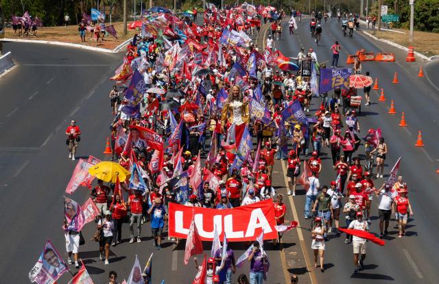 This aerial view shows supporters of Brazil's President and candidate for re-election Luiz Inacio Lula da Silva during a march as part of a national mobilization by the Workers' Party (PT) in Brasília, Brazil, on September 13, 2026. Brazil will hold presidential elections on October 4, 2026. (Photo by Sergio Lima / AFP)