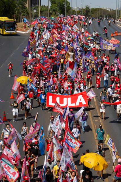 This aerial view shows supporters of Brazil's President and candidate for re-election Luiz Inacio Lula da Silva during a march as part of a national mobilization by the Workers' Party (PT) in Brasília, Brazil, on September 13, 2026. Brazil will hold presidential elections on October 4, 2026. (Photo by Sergio Lima / AFP)