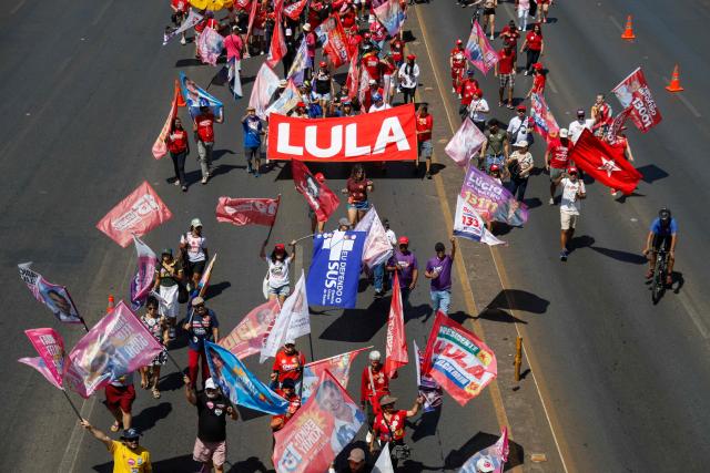 This aerial view shows supporters of Brazil's President and candidate for re-election Luiz Inacio Lula da Silva during a march as part of a national mobilization by the Workers' Party (PT) in Brasília, Brazil, on September 13, 2026. Brazil will hold presidential elections on October 4, 2026. (Photo by Sergio Lima / AFP)