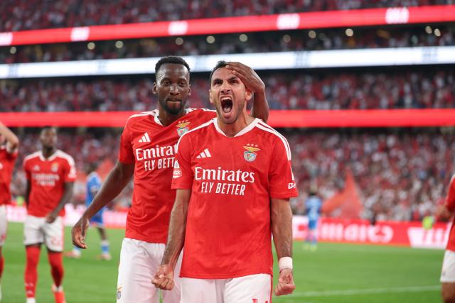 Benfica's Greek forward #14 Vangelis Pavlidis celebrates with Benfica's Belgian forward #11 Dodi Lukebakio scoring his team's second goal from the penalty spot during the Portuguese League football match between SL Benfica and Gil Vicente FC at Estadio da Luz in Lisbon on September 13, 2026. (Photo by Patricia de Melo Moreira / AFP)