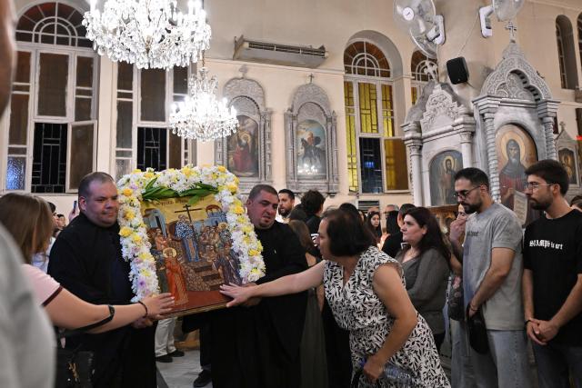 Christian worshippers attend the evening service for the Feast of the Cross at the Greek Orthodox Church of the Holy Cross in Damascus on September 13, 2026. (Photo by LOUAI BESHARA / AFP)