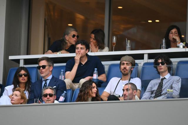 US actor Chris Pine (2L) and US singer Sombr (R) attend the men's singles final tennis match between USA's Ben Shelton and Germany's Alexander Zverev on day fifteen of the US Open tennis tournament at the USTA Billie Jean King National Tennis Center in New York City on September 13, 2026. (Photo by ANGELA WEISS / AFP)