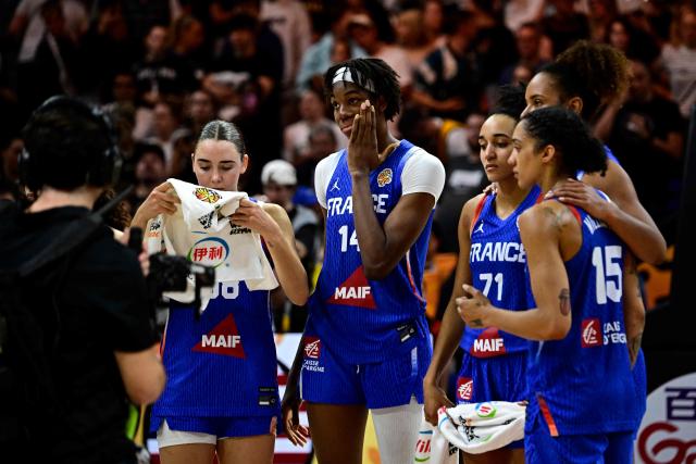 France's team reacts after the 2026 FIBA Women’s Basketball World Cup final game between the United States and France in Berlin on September 13, 2026. (Photo by Tobias SCHWARZ / AFP)