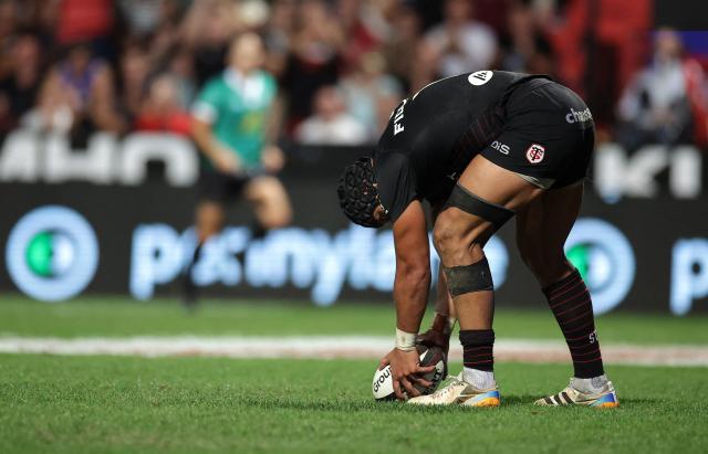 Toulouse's Argentine centre Santiago Chocobares prepare to score a try during the French Top 14 rugby union match between Stade Toulousain and Bordeaux-Begles at the Stade Ernest-Wallon in Toulouse, southwestern France on September 13, 2026.  (Photo by Valentine CHAPUIS / AFP)