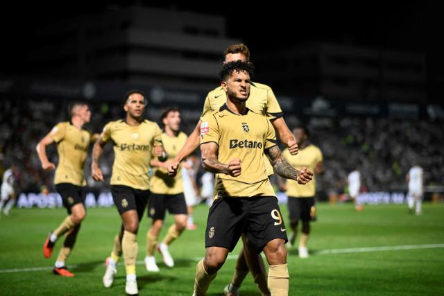 Sporting Lisbon's Colombian forward #97 Luis Suarez celebrates scoring his team's first goal from the penalty spot during the Portuguese League football match between FC Famalicao and Sporting CP at Estadio Municipal 22 de Junho in Vila Nova de Famalicao, on September 13, 2026. (Photo by Miguel RIOPA / AFP)