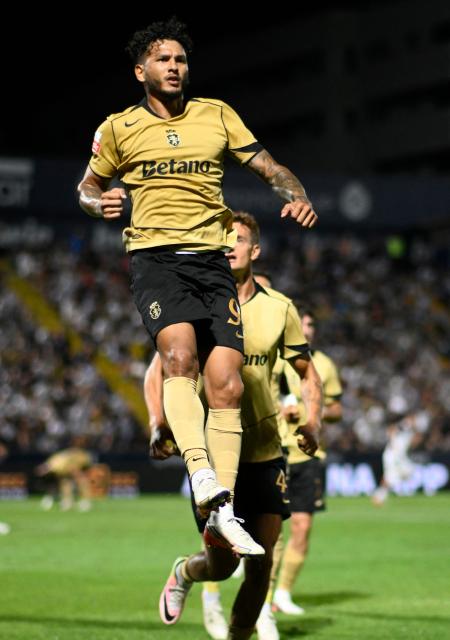 Sporting Lisbon's Colombian forward #97 Luis Suarez celebrates scoring his team's first goal from the penalty spot during the Portuguese League football match between FC Famalicao and Sporting CP at Estadio Municipal 22 de Junho in Vila Nova de Famalicao, on September 13, 2026. (Photo by Miguel RIOPA / AFP)