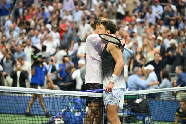 USA's Ben Shelton (R) congratulates Germany's Alexander Zverev after the men's singles final tennis match on day fifteen of the US Open tennis tournament at the USTA Billie Jean King National Tennis Center in New York City on September 13, 2026. (Photo by ANGELA WEISS / AFP)