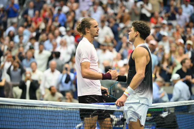 USA's Ben Shelton (R) shakes Germany's Alexander Zverev's hand after the men's singles final tennis match on day fifteen of the US Open tennis tournament at the USTA Billie Jean King National Tennis Center in New York City on September 13, 2026. (Photo by ANGELA WEISS / AFP)