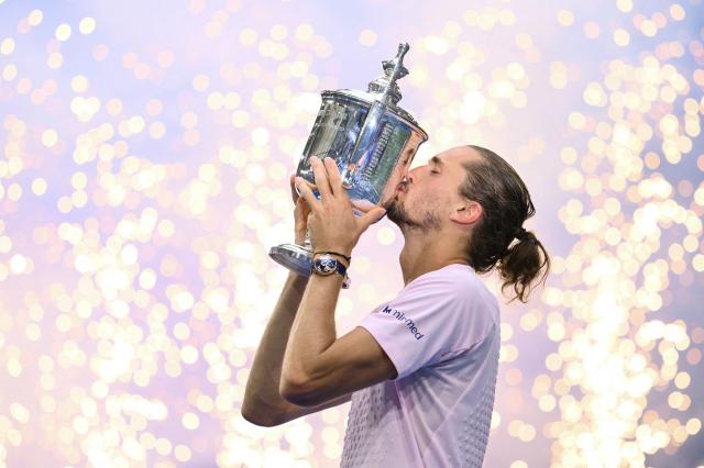 Germany's Alexander Zverev kisses the trophy after defeating USA's Ben Shelton in the men's singles final tennis match on day fifteen of the US Open tennis tournament at the USTA Billie Jean King National Tennis Center in New York on September 13, 2026. (Photo by ANGELA WEISS / AFP)