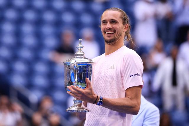 Germany's Alexander Zverev holds the trophy after defeating USA's Ben Shelton in the men's singles final tennis match on day fifteen of the US Open tennis tournament at the USTA Billie Jean King National Tennis Center in New York on September 13, 2026. (Photo by CHARLY TRIBALLEAU / AFP)