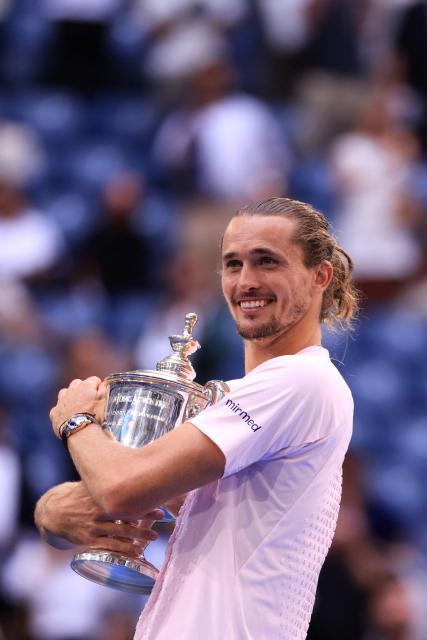 Germany's Alexander Zverev holds the trophy after defeating USA's Ben Shelton in the men's singles final tennis match on day fifteen of the US Open tennis tournament at the USTA Billie Jean King National Tennis Center in New York on September 13, 2026. (Photo by CHARLY TRIBALLEAU / AFP)