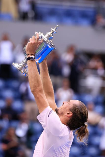 Germany's Alexander Zverev raises the trophy after defeating USA's Ben Shelton in the men's singles final tennis match on day fifteen of the US Open tennis tournament at the USTA Billie Jean King National Tennis Center in New York on September 13, 2026. (Photo by CHARLY TRIBALLEAU / AFP)