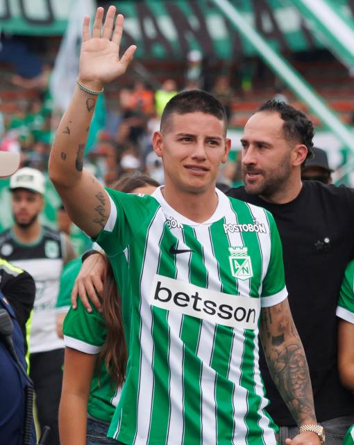 Colombia's midfielder James Rodriguez waves to fans of Aletico Nacional during his presentation at Atanasio Girardot Stadium in Medellin, Colombia on September 13, 2026. Rodriguez, 35, has completed one of the most high-profile signings in Colombian football in recent years. After Colombia's disappointing 2026 World Cup campaign and a frustrating spell in Major League Soccer (MLS), the playmaker will now represent Atletico Nacional, the most successful club in the country's history. (Photo by AFP stringer / AFP)