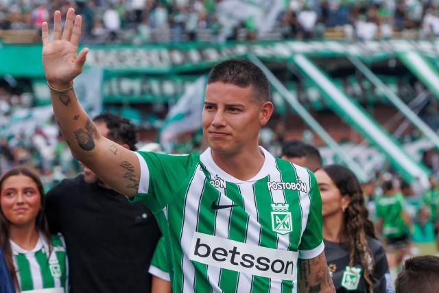 Colombia's midfielder James Rodriguez waves to fans of Aletico Nacional during his presentation at Atanasio Girardot Stadium in Medellin, Colombia on September 13, 2026. Rodriguez, 35, has completed one of the most high-profile signings in Colombian football in recent years. After Colombia's disappointing 2026 World Cup campaign and a frustrating spell in Major League Soccer (MLS), the playmaker will now represent Atletico Nacional, the most successful club in the country's history. (Photo by AFP stringer / AFP)