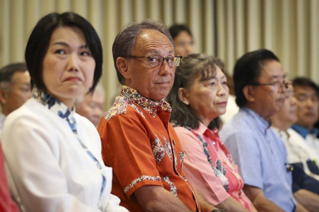 Denny Tamaki (2nd L) reacts after reports projected his defeat in the Okinawa gubernatorial election, in Naha, Okinawa prefecture on September 13, 2026. Tamaki, who was seeking his third term as governor of Okinawa, Japan's southernmost prefecture, lost to Genta Koja in the September 13 polls, bringing into power a leader who approves a contentious US military base relocation plan for the first time in 12 years. (Photo by JIJI PRESS / AFP) / Japan OUT