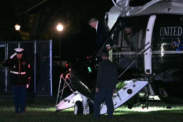 US President Donald Trump steps off Marine One on the Ellipse near the White House in Washington, DC, on September 13, 2026. Trump is returning from Ireland where he attended the Irish Open golf tournament at his family's course in Doonbeg over the weekend. (Photo by Jim WATSON / AFP)