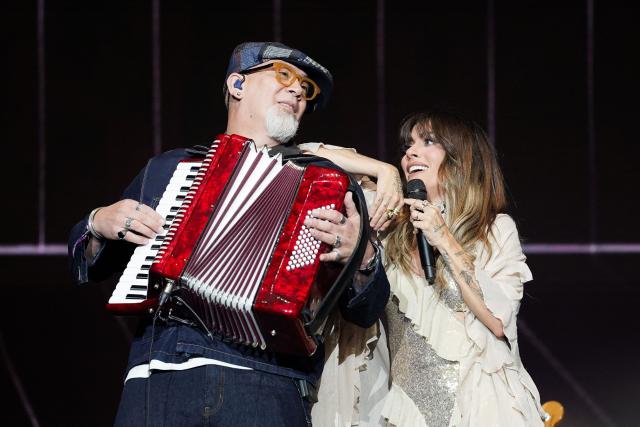 Puerto Rican singer Kany Garcia (R) performs on stage during the Cordillera music festival at the Simon Bolivar park in Bogota on September 13, 2026. (Photo by Alejandro GONZALEZ / AFP)