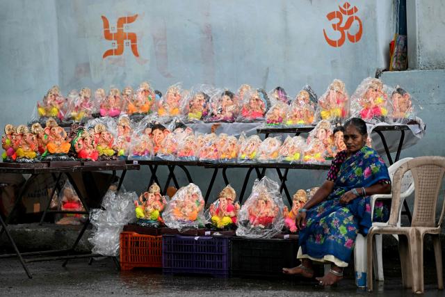 A roadside vendor sells idols of Hindu deity Ganesha on the occasion of ‘Ganesh Chaturthi’ festival in Hyderabad on September 14, 2026. (Photo by Noah SEELAM / AFP)