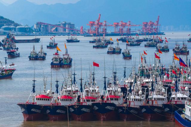 Fishing boats are seen at a wharf in Ningbo, in China’s eastern Zhejiang province as they prepare for the opening of the fishing season in the East China Sea on September 12, 2026. (Photo by CN-STR / AFP) / China OUT