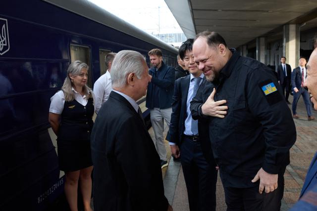Chairman of the Verkhovna Rada Ruslan Stefanchuk (R) welcomes Speaker of the House of Representatives of Japan Eisuke Mori (L) on his first visit to Ukraine as speaker, during which he is due to meet senior Ukrainian officials to reaffirm Japan's solidarity with Ukraine, at Kyiv railway station in Kyiv on September 14, 2026. (Photo by AFP)