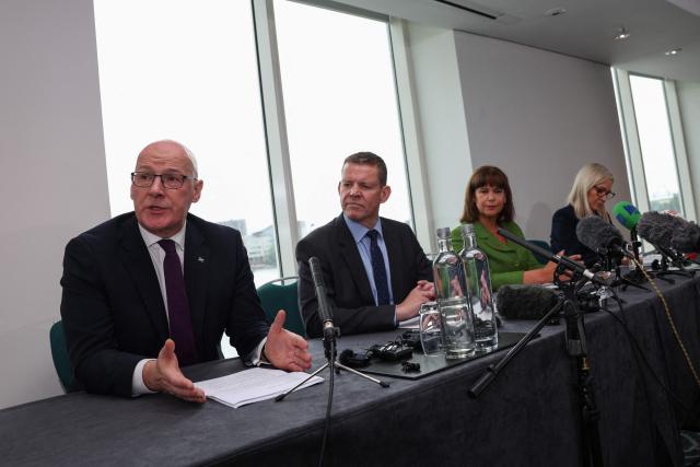 Scottish Nationalist Party (SNP) leader John Swinney (L) speaks as (2nd L to R) Rhun ap Iorwerth of Plaid Cymru in Wales, Mary Lou McDonald, president of Irish Republicans Sinn Fein and Michelle O'Neill, vice president of Irish Republicans Sinn Fein look on, as they attend a meeting in Cardiff, Wales on September 14, 2026, to press for self-determination votes in their territories. The leaders of the main Scottish, Welsh and Northern Irish separatist parties were to hold rare talks on September 14 aiming to advance their campaigns to break away from Britain, they announced in a statement. (Photo by Adrian DENNIS / AFP)
