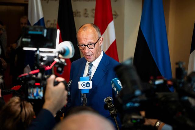 German Chancellor Friedrich Merz speaks with journalists as he arrives at the Arktikum science centre to attend The European Arctic Summit in Rovaniemi, Finland, on September 14, 2026. EU leaders meet in Finland's northern city of Rovaniemi to discuss how to strengthen the bloc's presence in the Arctic amid an international showdown over the strategic region. US President Donald Trump's repeated threats to bring Greenland -- an autonomous Danish territory --  under US control, has triggered a diplomatic crisis among allies. (Photo by Jouni Porsanger / Lehtikuva / AFP) / Finland OUT