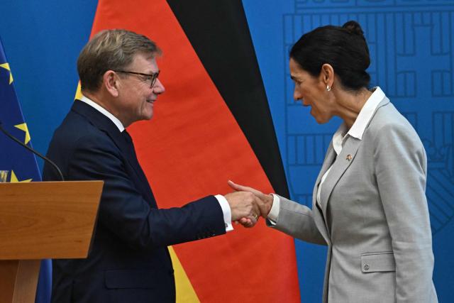 Hungary's Foreign Minister Anita Orban (R) and German Foreign Minister Johann Wadephul shake hands following their joint press conference on September 14, 2026 in Budapest. It is Wadephul’s first trip to the EU country and the first visit by a German foreign minister to Budapest since 2019. (Photo by Attila KISBENEDEK / AFP)