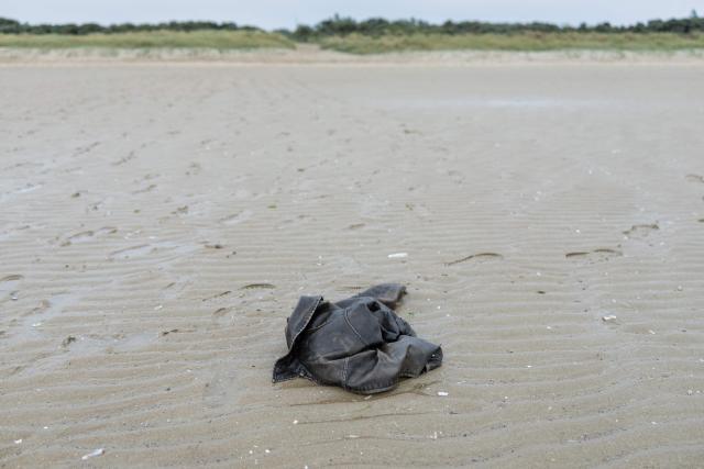 This photograph shows a jacket left by migrants on the beach of Gravelines, northern France, on September 14, 2026. (Photo by Sameer Al-DOUMY / AFP)