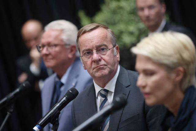 German Defence Minister Boris Pistorius (C) attends a press conference with Rheinmetall Chief Executive Officer Armin Papperger (L) and Mecklenburg-Western Pomerania State Premier Manuela Schwesig (R), during a ceremony to lay the keel for the third fleet service vessel, at the Peene-Werft shipyard in Wolgast, northeastern Germany, on September 14, 2026. (Photo by Danny Gohlke / AFP)