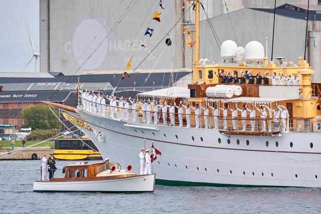 Crew members line the deck of the Royal Yacht Dannebrog as Denmark’s King Frederik X and Queen Mary arrive at Nordre Toldbod ahead of their official disembarkation in Copenhagen, Denmark, on September 14, 2026. (Photo by Thomas Traasdahl / Ritzau Scanpix / AFP) / Denmark OUT