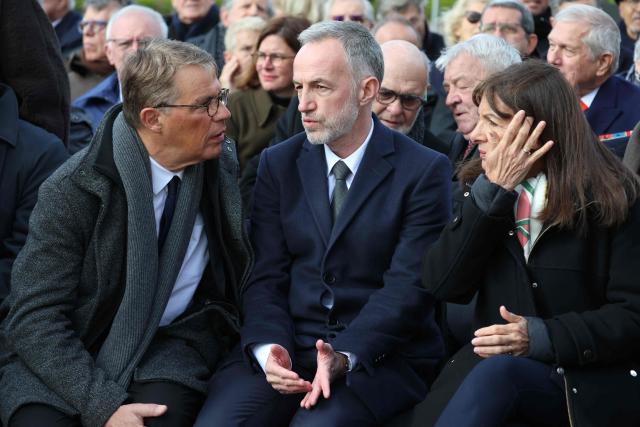 (FILES) (From L) Former Paris' first deputy mayor Patrick Bloche, mayor of Paris Emmanuel Gregoire and former mayor of Paris Anne Hidalgo attend a national tribute to former French Prime Minister Lionel Jospin at the Hotel des Invalides in Paris on March 26, 2026. Anne Hidalgo and her former deputy mayor, Patrick Bloche, are to be questioned on September 15, 2026 by the Senate committee of inquiry into after-school care in France, ahead of another hearing with the capital’s mayor Emmanuel Grйgoire on September 16. More than fifteen families who have reported violence and sexual abuse against their children during after-school care announced on September 4, 2026, that they were filing a complaint against the City of Paris and its Socialist mayor, Emmanuel Gregoire, as well as his predecessor, Anne Hidalgo. United under the MeTooEcole association, these families – whose children attend various schools across the capital – are calling on the courts to investigate what the local authorities knew about the failings in after-school care, and their alleged failure to take action to remedy them. (Photo by Ludovic MARIN / AFP)