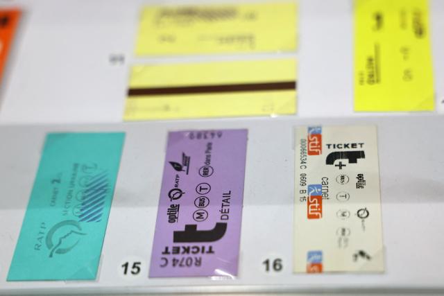 This photograph shows several generations of parisian metro tickets on display at the RATP house in Paris on September 14, 2026. These tickets will be permanently phased out at the end of 2026, replaced by digital passes. (Photo by Anne-Christine POUJOULAT / AFP)