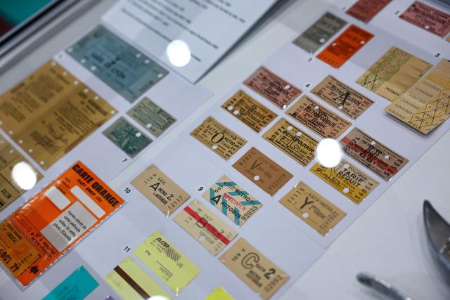 This photograph shows several generations of parisian metro tickets on display at the RATP house in Paris on September 14, 2026. These tickets will be permanently phased out at the end of 2026, replaced by digital passes. (Photo by Anne-Christine POUJOULAT / AFP)