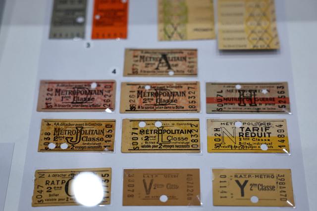 This photograph shows several generations of parisian metro tickets on display at the RATP house in Paris on September 14, 2026. These tickets will be permanently phased out at the end of 2026, replaced by digital passes. (Photo by Anne-Christine POUJOULAT / AFP)